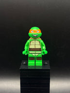 LEGO Minifigura Michelangelo, Grin - Teenage Mutant Ninja Turtles — frente