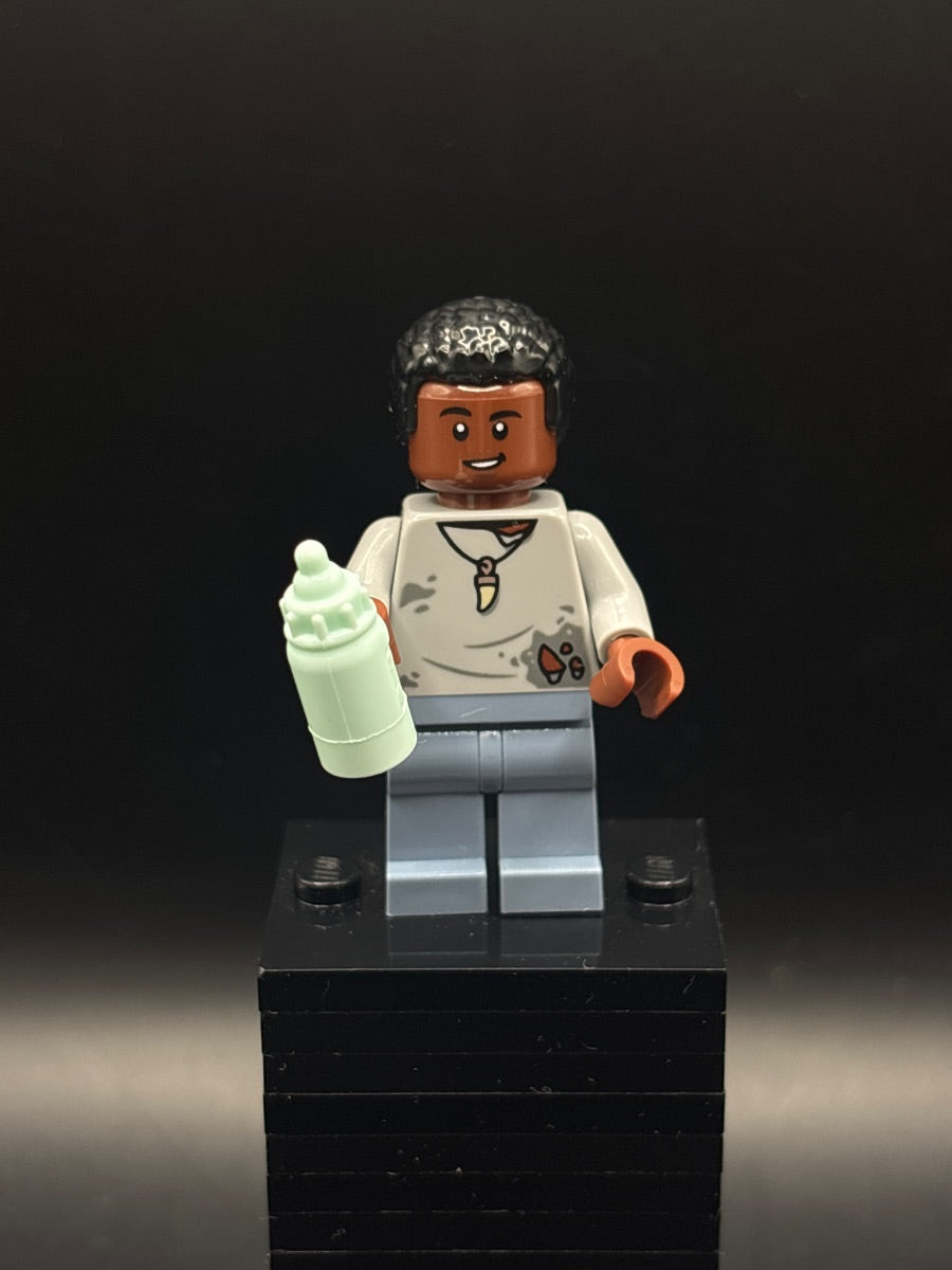 LEGO Minifigura Darius Bowman - Light Bluish Gray Torn Shirt, Sand Blue Legs - Jurassic World — frente
